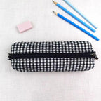 Black White Grid Print Elongated Cylindrical Quilted Stationery Pouch With Heart Stitch Detailing And Full Width Top Slide Zipper Closure